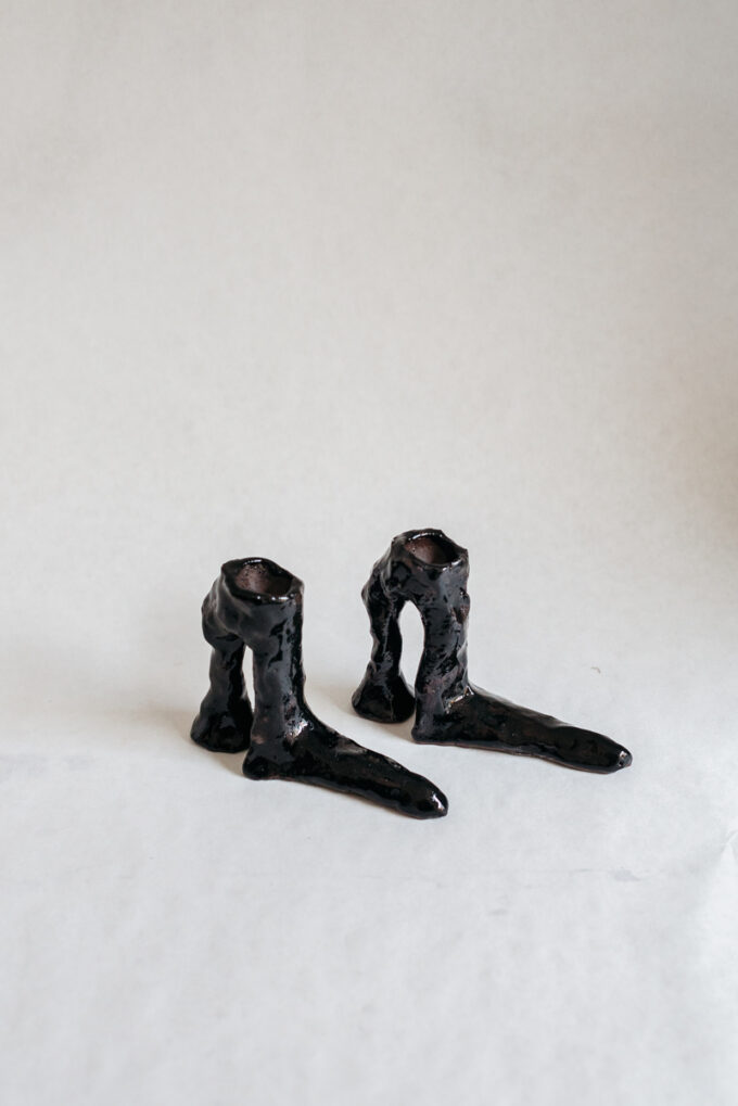 Hot legs candlesticks with black glaze, by Laura Welker