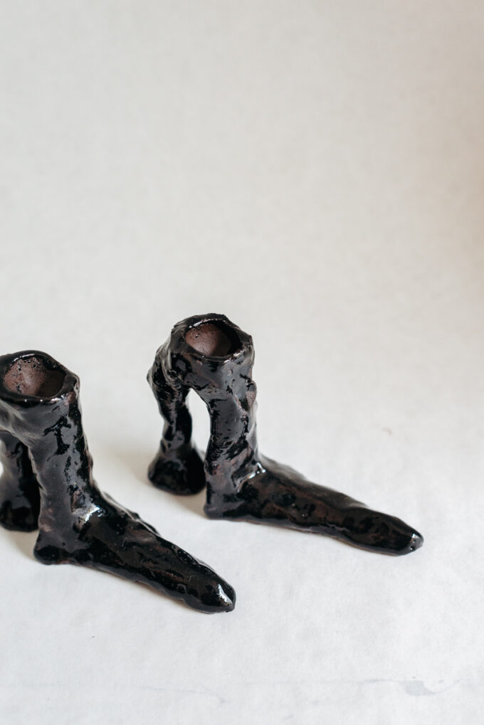 Hot legs candlesticks with black glaze, by Laura Welker