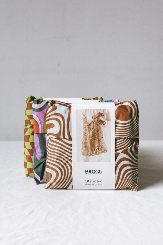 Baggu reusable bags in various prints: trippy swirl, trippy checkers, woodgrain