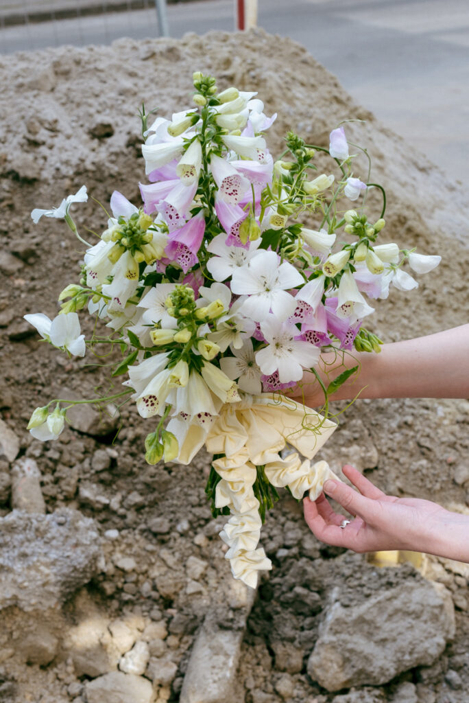 Wedding bouquet with seasonal summer flowers and handmade ribbon by Wilder Antwerp