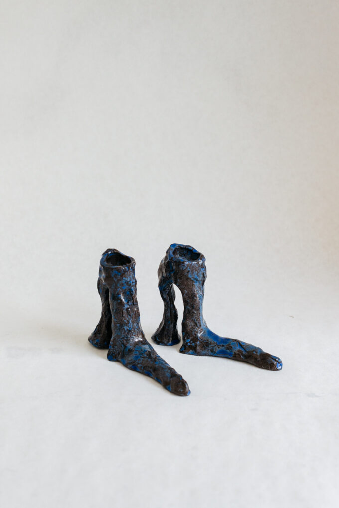 Hot legs candlesticks with blue glaze, by Laura Welker