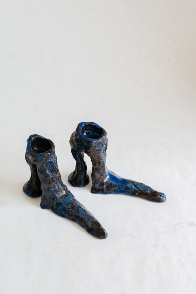 Hot legs candlesticks with blue glaze, by Laura Welker