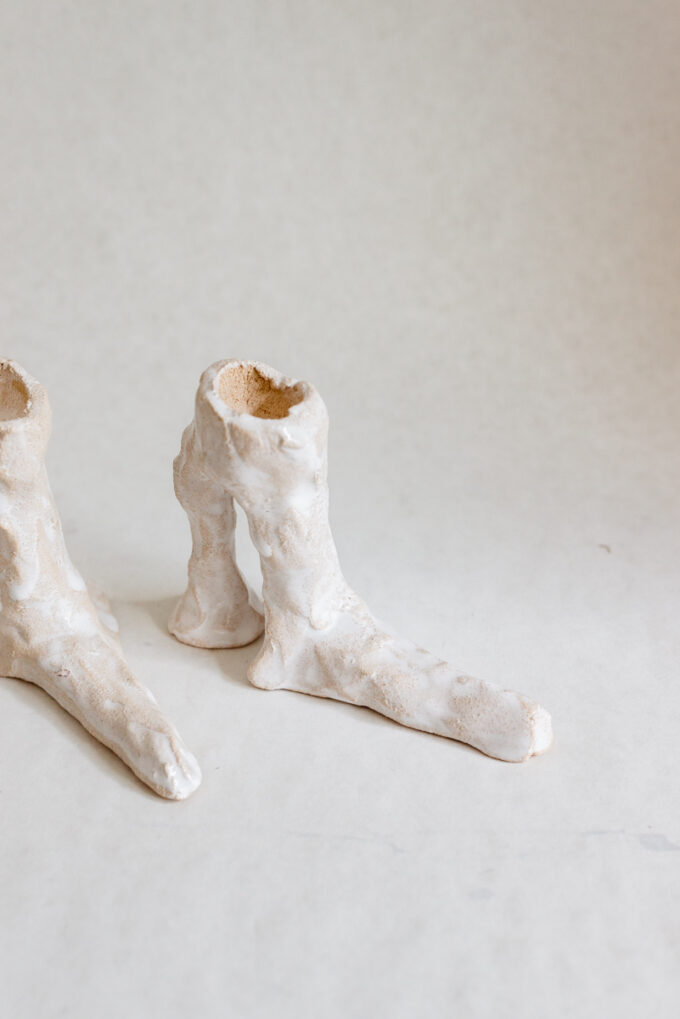 Hot legs candlesticks with white glaze, by Laura Welker